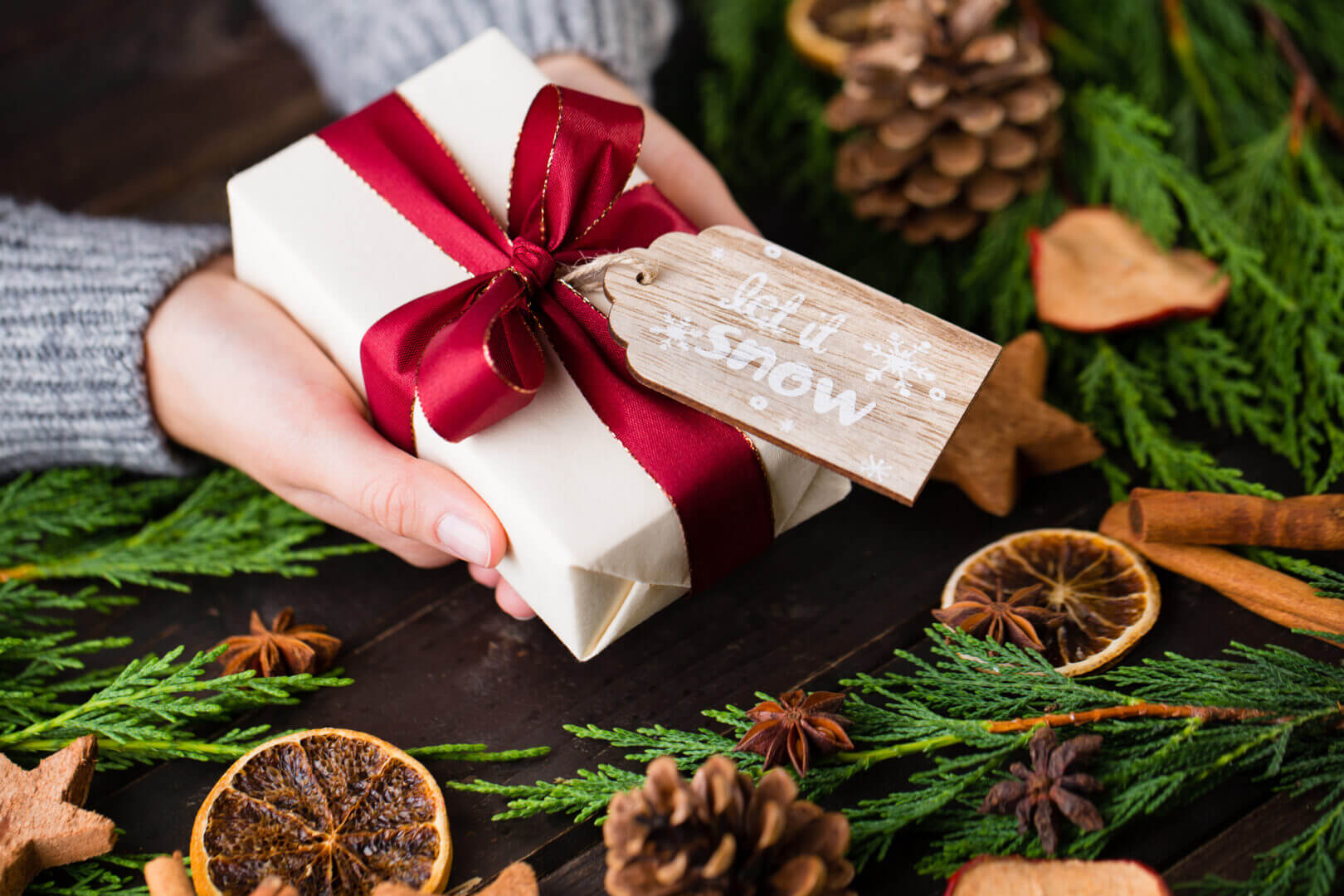 Christmas gift on the antique wooden background.